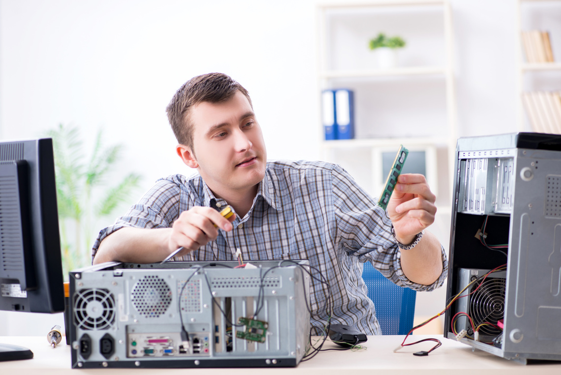 Technician Repairing Computer